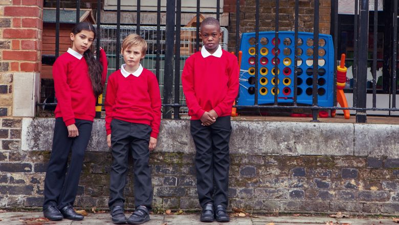 three young children in school uniform